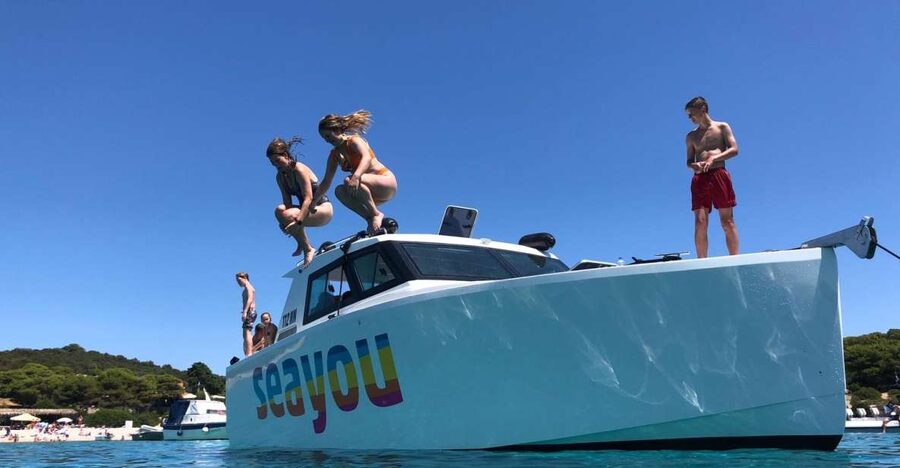 From Split: Luxury Cabin Boat Tour to The Blue Cave and Hvar - Swimming near Budikovac at the Blue Lagoon