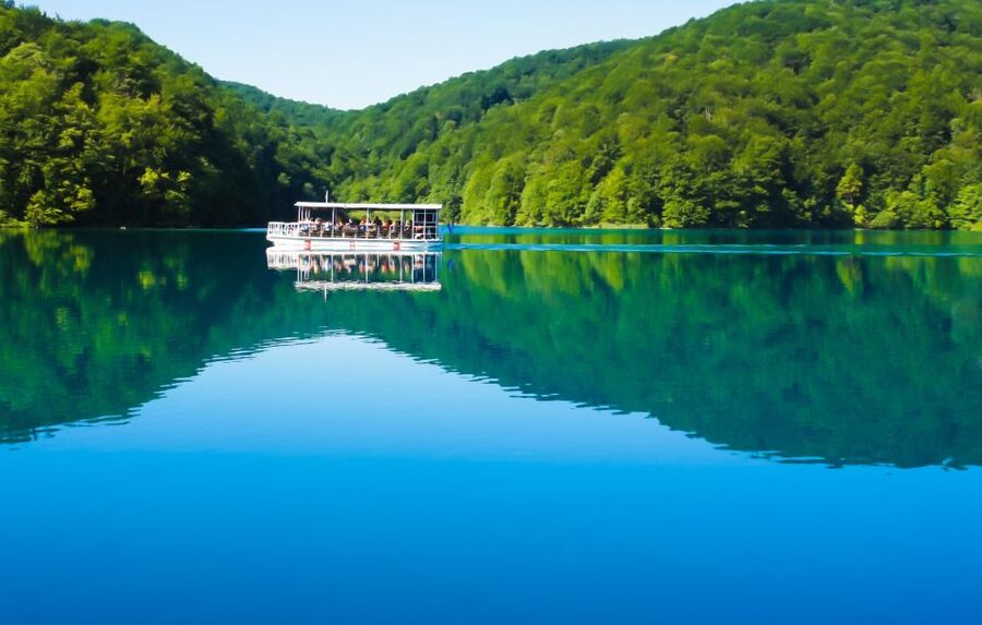 From Split: Plitvice Lakes Guided Tour with Entry Tickets - The boat crossing and electric train