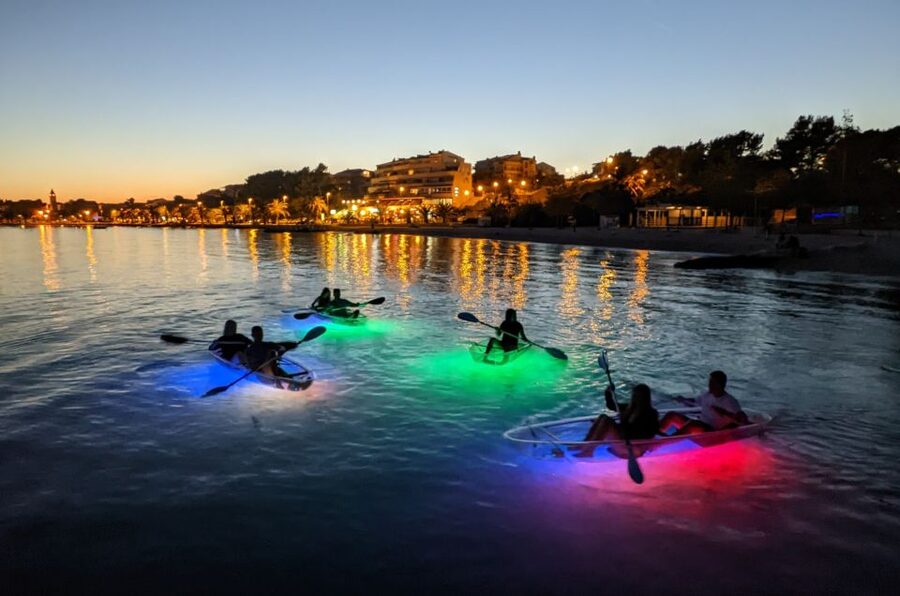 Split: Illuminated Evening Guided Kayaking Tour - Back on the sea, toward the rocks and cliffs