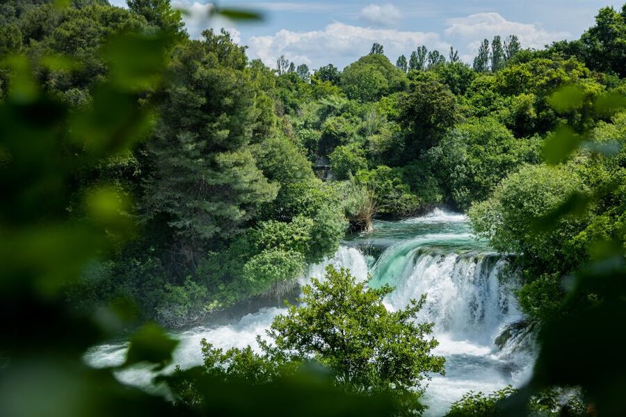 Split: Krka National Park Day Trip with Boat Ride & Swimming - Skradin beach, swimming, and free time