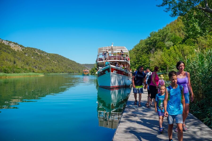 Split: Krka Waterfalls Trip with Boat Cruise and Swimming - Krka Falls, a boat ride, and a beach town in one day