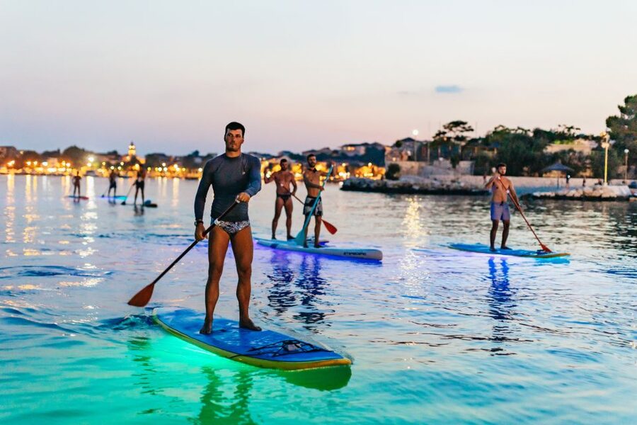 Split: Stand Up Paddleboard Night Glow Tour - Sea, cliffs, and traditional houses as night falls
