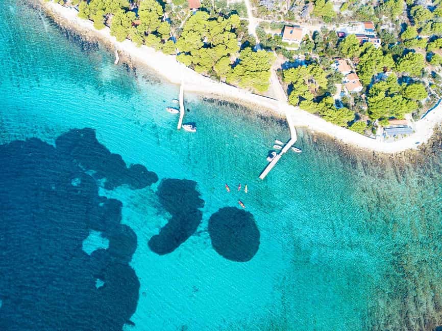 Trogir: Blue Lagoon, Maslinica, and Solinska Bay Boat Tour - Maslinica: stone lanes and a castle stop
